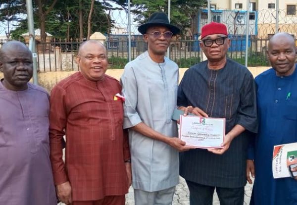 labour party national chairman barrister julius abure handing over the certificate of return to hon chuma nzeribe candidate for the anambra south senatorial election.