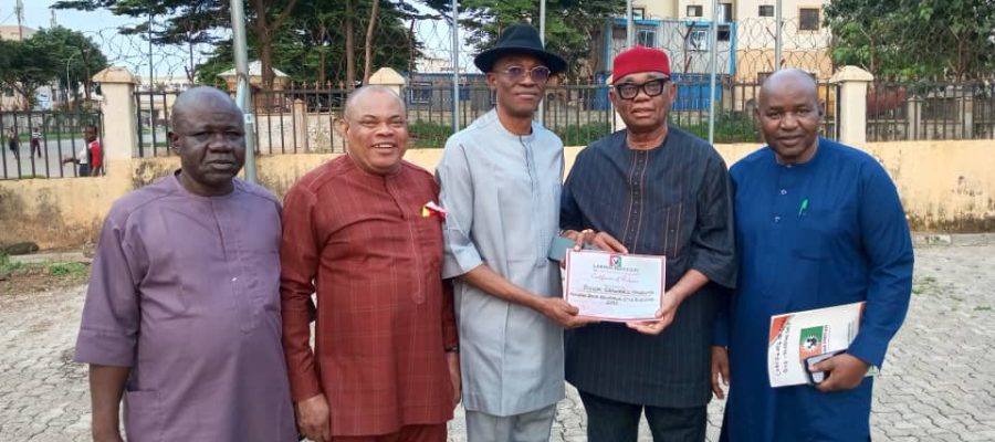 labour party national chairman barrister julius abure handing over the certificate of return to hon chuma nzeribe candidate for the anambra south senatorial election.